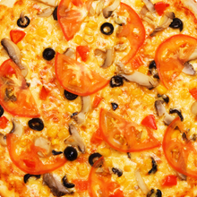 Whole pizza with tomatos
